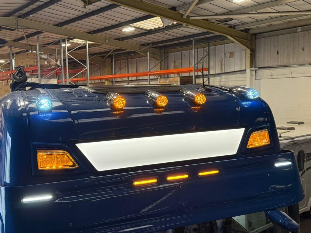 Lorry cab fitted with a roof beacon bar, marker lights and LED work lights